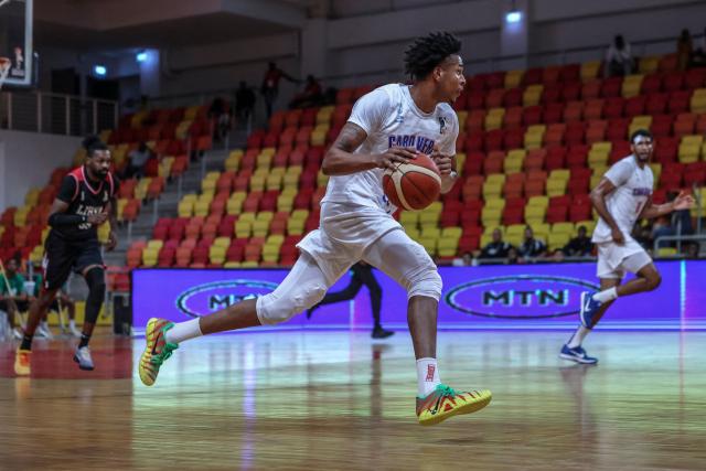Cape Verde's #34 Patrick Mendes runs with the ball during a basketball match game between Cape Verde vs Libya played on the third day of the African qualifying for the 2027 Men's Basketball World Cup in Qatar, in Douala on July 5, 2026. (Photo by Daniel BELOUMOU OLOMO / AFP)