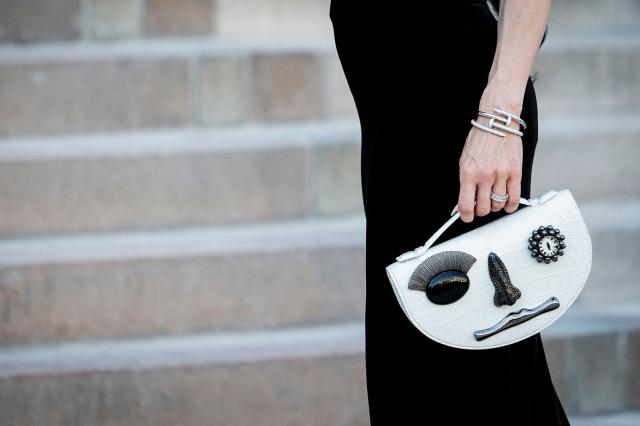 The bag of Sandra Corinna Kinzl is pictured upon her arrival for the Schiaparelli Women Haute Couture Fall/Winter 2026-2027 collection as part of the Paris Fashion Week, in Paris, on July 6, 2026. (Photo by GEOFFROY VAN DER HASSELT / AFP)