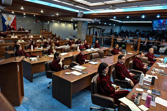 Philippine Senators acting as judges of the impeachment court participate during the impeachment trial of Philippine Vice President Sara Duterte at the Philippine Senate in Pasay City, Metro Manila on July 6, 2026. The Philippine Senate opened Vice President Sara Duterte's impeachment trial on July 6, with her political career -- and a planned 2028 presidential run -- in the balance. (Photo by NOEL CELIS / AFP)