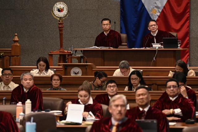 Philippine Senators acting as judges of the impeachment court participate during the impeachment trial of Philippine Vice President Sara Duterte at the Philippine Senate in Pasay City, Metro Manila on July 6, 2026. The Philippine Senate opened Vice President Sara Duterte's impeachment trial on July 6, with her political career -- and a planned 2028 presidential run -- in the balance. (Photo by NOEL CELIS / AFP)
