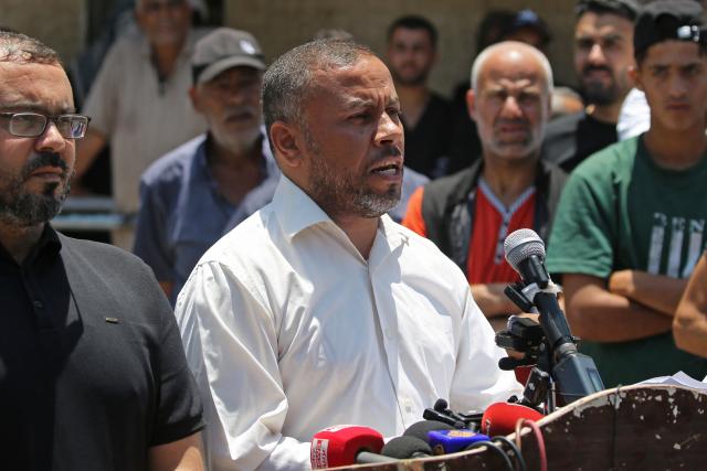 Ismail al-Thawabta, head of Hamas' government media office, addresses a press conference at the Al-Aqsa Hospital in Deir al-Balah, central Gaza Strip on July 6, 2026. Palestinian Islamist movement Hamas announced on July 6 the dissolution of the body that has governed the Gaza Strip for nearly two decades, clearing the way for a technocratic committee to implement civilian rule. (Photo by Eyad Baba / AFP)