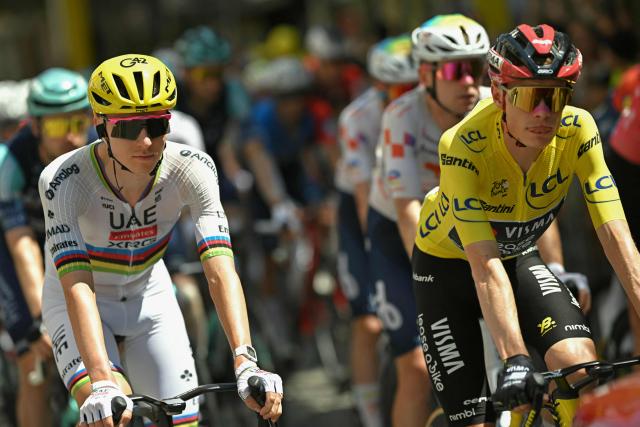 UAE Team Emirates - XRG's Slovenian rider Tadej Pogacar and Team Visma | Lease a Bike's Danish rider Jonas Vingegaard wearing the overall leader's yellow jersey cycle at the start of the 3rd stage of the 113th edition of the Tour de France cycling race, 196 km between Granollers and Les Angles in southern France, on July 6, 2026. (Photo by Loic VENANCE / AFP)