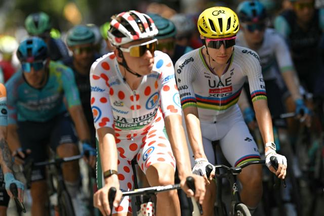 UAE Team Emirates - XRG's Slovenian rider Tadej Pogacar (R) and Team Visma | Lease a Bike's Danish rider Jonas Vingegaard wearing the overall leader's yellow jersey cycle at the start of the 3rd stage of the 113th edition of the Tour de France cycling race, 196 km between Granollers and Les Angles in southern France, on July 6, 2026. (Photo by Loic VENANCE / AFP)