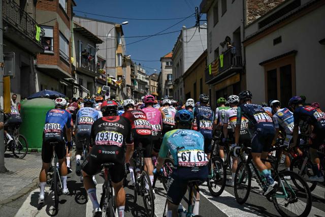 The pack of riders (peloton) cycles in San Feliu de Codines during the 3rd stage of the 113th edition of the Tour de France cycling race, 195,9 km between Granollers in Spain and Les Angles in southern France, on July 6, 2026. (Photo by Loic VENANCE / AFP)