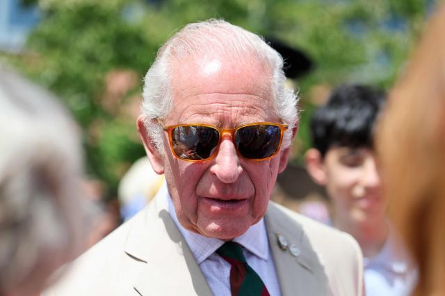 Britain's King Charles III, wearing sunglasses, meets RTR soldiers and their families during The Royal Tank Regiment's Families' Day at the Tank Museum on July 6, 2026 in Bovington, south-west England. (Photo by Chris Jackson / POOL / AFP)