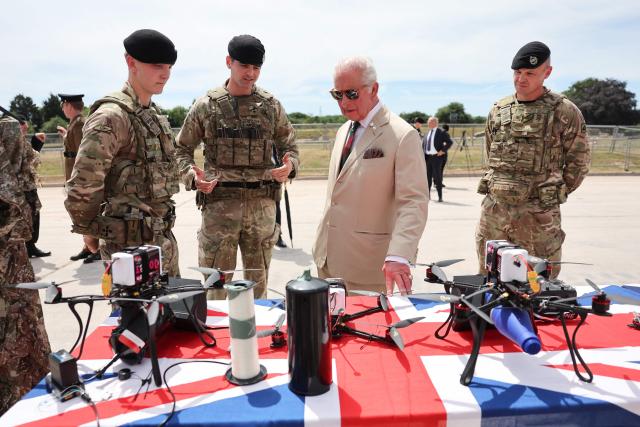 Britain's King Charles III looks at a display of drones during a visit on The Royal Tank Regiment's Families' Day at the Tank Museum on July 6, 2026 in Bovington, south-west England. (Photo by Chris Jackson / POOL / AFP)