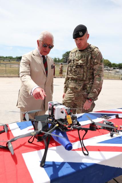 Britain's King Charles III looks at a display of drones during a visit on The Royal Tank Regiment's Families' Day at the Tank Museum on July 6, 2026 in Bovington, south-west England. (Photo by Chris Jackson / POOL / AFP)