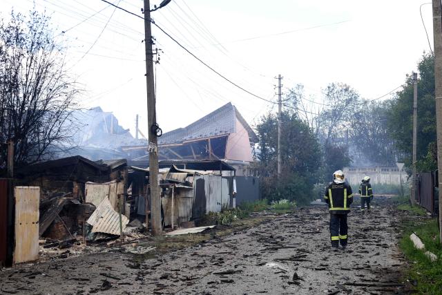 Firefighters walk through a destroyed residential area in Vyshneve, Kyiv suburb, following a Russian missile strike on the Ukrainian capital of Kyiv on July 6, 2026, amid the Russian invasion of Ukraine. Officials in the Kyiv suburb of Vyshneve said they were evacuating residents due to the possibility of unexploded munitions in the debris. (Photo by Serhii Okunev / AFP)