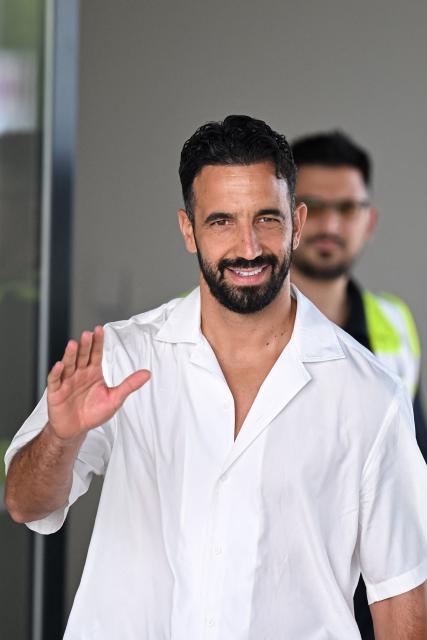 Italian football club AC Milan's newly recruited Portuguese coach Ruben Amorim waves upon his arrival at Linate Airport in Milan on July 6, 2026. (Photo by Piero CRUCIATTI / AFP)