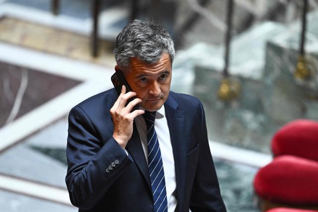 France's Justice Minister Gerald Darmanin uses his phone ahead of a voting session on a no-confidence motion tabled by France's ecologist party Les Ecologistes at the National Assembly, France's lower house of parliament in Paris on July 6, 2026. (Photo by JULIEN DE ROSA / AFP)
