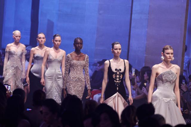 Models present creations by Georges Hobeika for the Women Haute Couture Fall/Winter 2026-2027 collection as part of the Paris Fashion Week, in Paris, on July 6, 2026. (Photo by GEOFFROY VAN DER HASSELT / AFP)