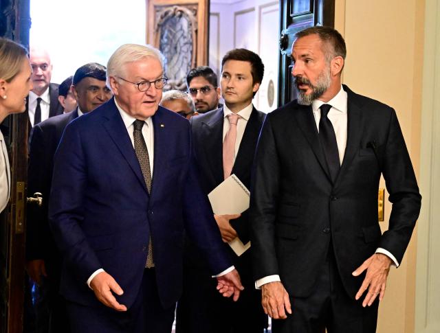 German President Frank-Walter Steinmeier (L) welcomes Prince Rahim al-Hussaini , Aga Khan V, the 50th hereditary Imam of the Nizari Isma'ili Shia Islam, on July 6, 2026 in Berlin. (Photo by Tobias SCHWARZ / AFP)