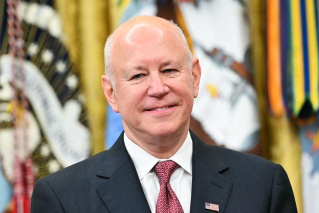 Chairperson of Intercontinental Exchange Jeffrey Sprecher looks on as US President Donald Trump speaks at the launch of Trump investment accounts in the Oval Office of the White House in Washington, DC, on July 6, 2026. Trump accounts are a new type of tax-deferred investment accounts for children. (Photo by Mandel NGAN / AFP)