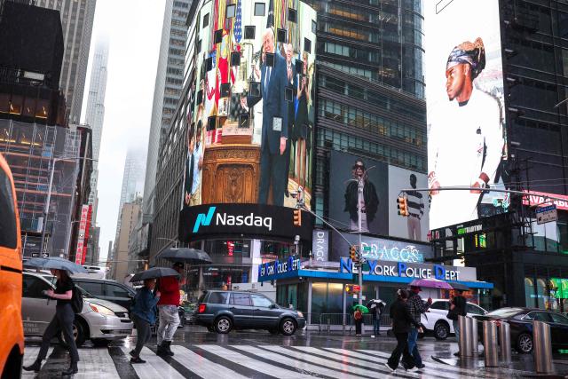 US President Donald Trump is displayed outside the Nasdaq headquarters as he opens the stock market remotely from the Oval Office at the White House, in New York, on July 6, 2026. The New York Stock Exchange and Nasdaq were opened remotely by US President Donald Trump to mark the launch of Trump investment accounts for children. (Photo by CHARLY TRIBALLEAU / AFP)