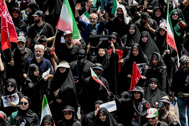 Mourners march towards Azadi Square in Tehran on July 6, 2026 during a funeral procession for Iran's slain supreme leader Ali Khamenei and his family members. Massive crowds are expected on July 6 for the funeral procession of late Iranian supreme leader Ali Khamenei in Tehran, with authorities hoping to avoid a repeat of the chaos that accompanied his predecessor's funeral. (Photo by Wakil Kohsar / AFP) / 