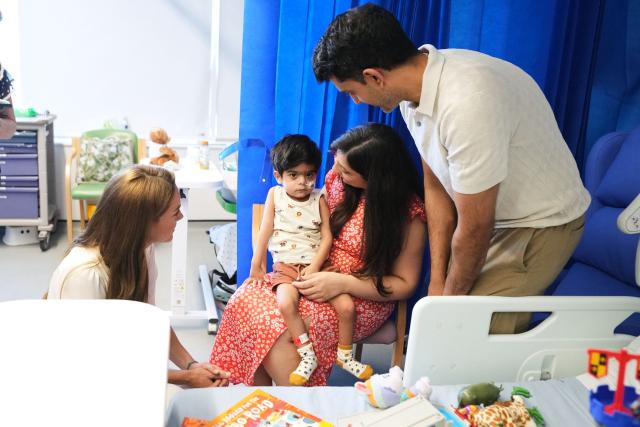 Britain's Catherine, Princess of Wales (L), talks to young Arjun and his family at the Edward ward as she visits Evelina London Children's Hospital on July 6, 2026 (Photo by Alastair Grant / POOL / AFP)