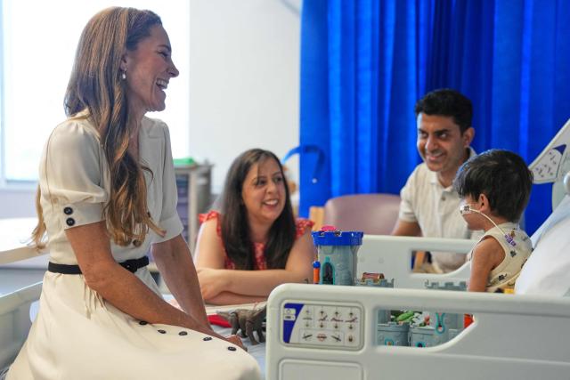 Britain's Catherine, Princess of Wales (L), talks to young Arjun and his family at the Edward ward as she visits Evelina London Children's Hospital on July 6, 2026 (Photo by Alastair Grant / POOL / AFP)