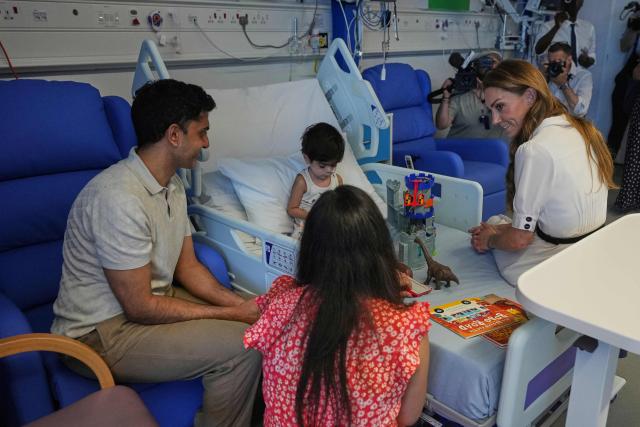 Britain's Catherine, Princess of Wales (R), talks to young Arjun and his family at the Edward ward as she visits Evelina London Children's Hospital on July 6, 2026 (Photo by Alastair Grant / POOL / AFP)