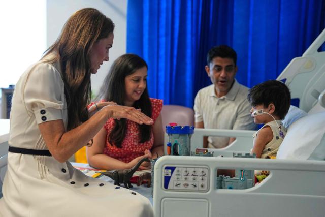 Britain's Catherine, Princess of Wales (L), talks to young Arjun and his family at the Edward ward as she visits Evelina London Children's Hospital on July 6, 2026 (Photo by Alastair Grant / POOL / AFP)