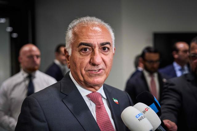 Son of Iran's last shah, opposition figure Prince Reza Pahlavi (R) speaks to the press as he takes part in a roundtable discussion regarding the situation in Iran at the Dutch parliament in The Hague on July 6, 2026. (Photo by Phil Nijhuis / ANP / AFP) / Netherlands OUT