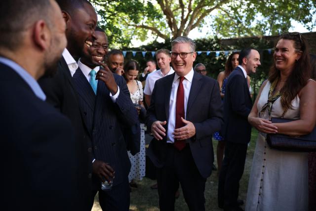 Britain's Prime Minister Keir Starmer talks to guests during a reception for NHS staff at 10 Downing Street in London on July 6, 2026. (Photo by Dan Kitwood / POOL / AFP)