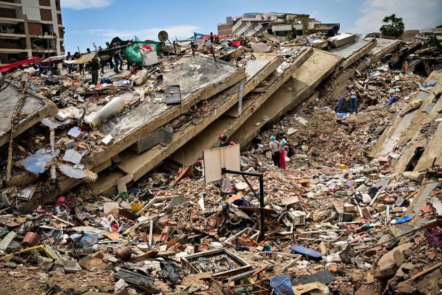 A destroyed basketball court is seen amid the debris of a collapsed building in the Caribe sector of Caraballeda, La Guaira state, Venezuela, on July 6, 2026, following powerful earthquakes that struck the region. The earthquakes that struck Venezuela on June 24 have claimed the lives of at least 3,342 people, the Venezuelan government reported on July 5. (Photo by MARTIN BERNETTI / AFP)