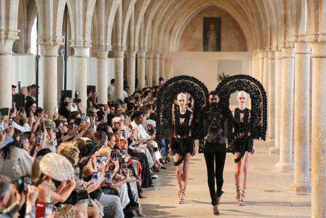 Models present creations by Rahul Mishra for the Women Haute Couture Fall/Winter 2026-2027 collection as part of the Paris Fashion Week, in Paris, on July 6, 2026. (Photo by Thomas SAMSON / AFP)