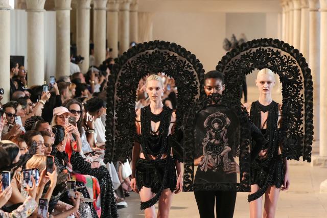 Models present creations by Rahul Mishra for the Women Haute Couture Fall/Winter 2026-2027 collection as part of the Paris Fashion Week, in Paris, on July 6, 2026. (Photo by Thomas SAMSON / AFP)