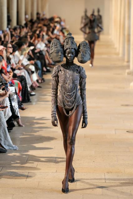 A model presents a creation by Rahul Mishra for the Women Haute Couture Fall/Winter 2026-2027 collection as part of the Paris Fashion Week, in Paris, on July 6, 2026. (Photo by Thomas SAMSON / AFP)