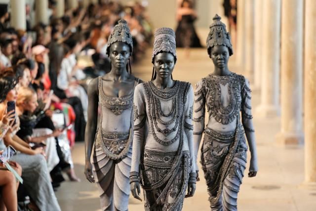 Models present creations by Rahul Mishra for the Women Haute Couture Fall/Winter 2026-2027 collection as part of the Paris Fashion Week, in Paris, on July 6, 2026. (Photo by Thomas SAMSON / AFP)