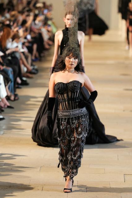 A model presents a creation by Rahul Mishra for the Women Haute Couture Fall/Winter 2026-2027 collection as part of the Paris Fashion Week, in Paris, on July 6, 2026. (Photo by Thomas SAMSON / AFP)