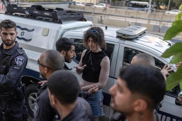 An Israeli left-wing activist is searched by Israeli police in Tel Aviv on July 6, 2026, during a rally calling for release of Palestinian Gaza Doctor Hussan Abu Safiya, detained by Israeli forces since December 2024. Last month, Israel's Supreme Court struck down a government ban preventing International Committee of the Red Cross (ICRC) delegates from visiting Palestinian detainees in Israeli prisons, prompting calls on June 4 to resume such visits. (Photo by ilia YEFIMOVICH / AFP)
