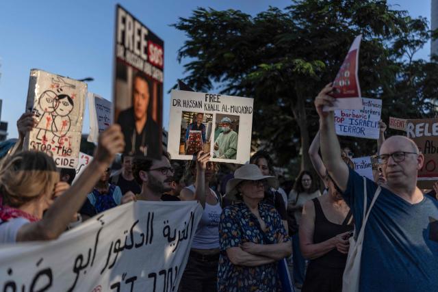 Israeli left wing activist hold placards and chant slogans in Tel Aviv on July 6, 2026, during a rally calling for release of Palestinian Gaza Doctor Hussan Abu Safiya, detained by Israeli forces since December 2024. Last month, Israel's Supreme Court struck down a government ban preventing International Committee of the Red Cross (ICRC) delegates from visiting Palestinian detainees in Israeli prisons, prompting calls on June 4 to resume such visits. (Photo by ilia YEFIMOVICH / AFP)