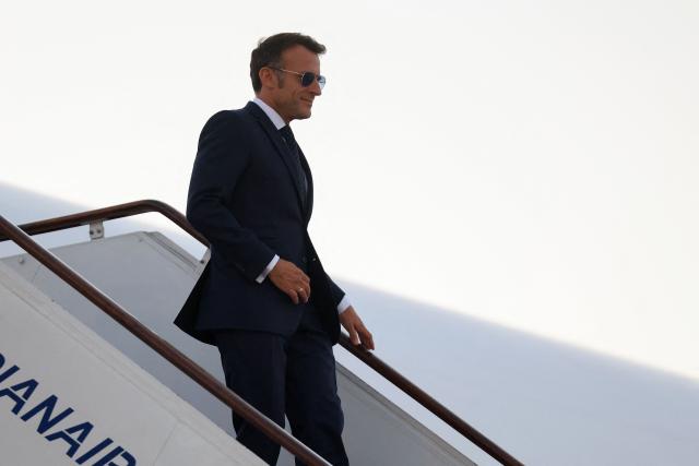 France's President Emmanuel Macron disembarks from his plane upon arrival at the Damascus International Airport for a state visit, in Damascus on July 6, 2026. French President Emmanuel Macron arrived in Damascus on July 6, 2026 for the first visit by a Western European head of state since Syria's new authorities took power in 2024, an AFP journalist said. Macron, who will depart on July 7, 2026, will advocate for "a free, pluralist Syria that respects each of its components" and plays a role in moderating Middle East tensions, the French presidency told journalists ahead of his arrival. (Photo by Ludovic MARIN / AFP)