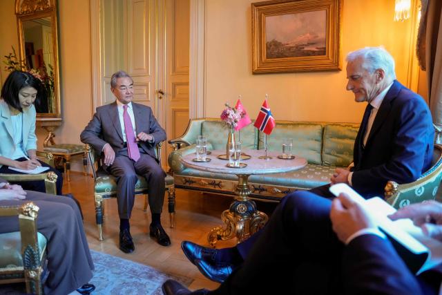 Chinese Foreign Minister Wang Yi (2 nd L) and Norwegian Prime Minister Jonas Gahr Store (R) meet at the Prime Minister's Residence in Oslo, Norway on July 6, 2026. (Photo by Javad Parsa / NTB / AFP) / Norway OUT