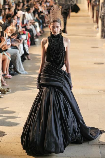 A model presents a creation by Rahul Mishra for the Women Haute Couture Fall/Winter 2026-2027 collection as part of the Paris Fashion Week, in Paris, on July 6, 2026. (Photo by Thomas SAMSON / AFP)