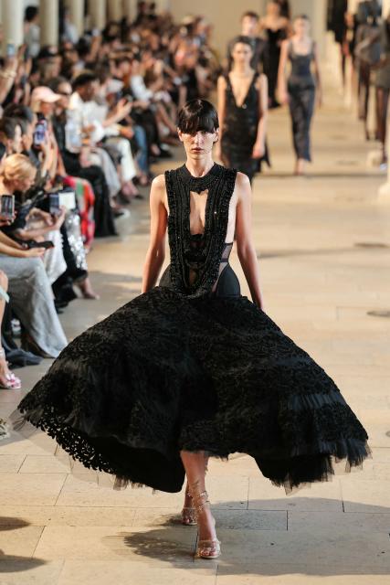 A model presents a creation by Rahul Mishra for the Women Haute Couture Fall/Winter 2026-2027 collection as part of the Paris Fashion Week, in Paris, on July 6, 2026. (Photo by Thomas SAMSON / AFP)