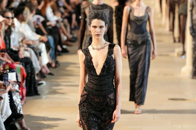 A model presents a creation by Rahul Mishra for the Women Haute Couture Fall/Winter 2026-2027 collection as part of the Paris Fashion Week, in Paris, on July 6, 2026. (Photo by Thomas SAMSON / AFP)
