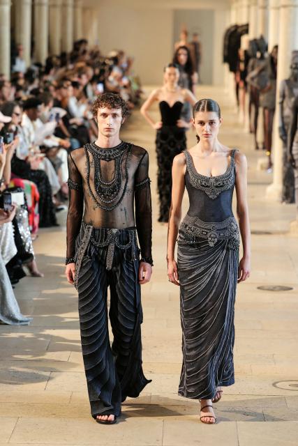 Models present creations by Rahul Mishra for the Women Haute Couture Fall/Winter 2026-2027 collection as part of the Paris Fashion Week, in Paris, on July 6, 2026. (Photo by Thomas SAMSON / AFP)