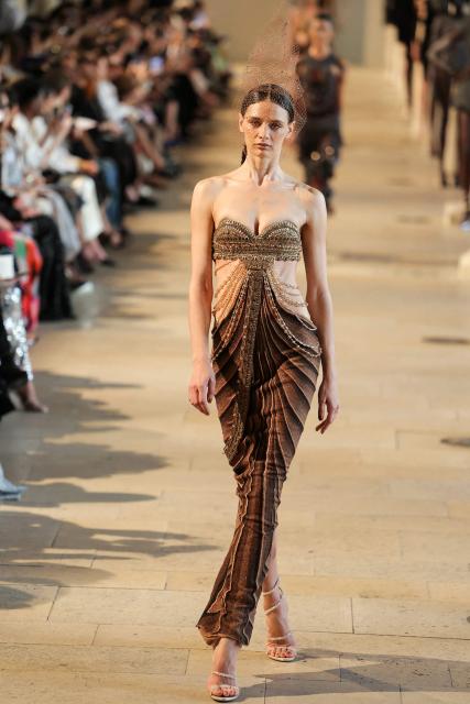 A model presents a creation by Rahul Mishra for the Women Haute Couture Fall/Winter 2026-2027 collection as part of the Paris Fashion Week, in Paris, on July 6, 2026. (Photo by Thomas SAMSON / AFP)