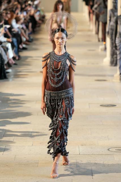 A model presents a creation by Rahul Mishra for the Women Haute Couture Fall/Winter 2026-2027 collection as part of the Paris Fashion Week, in Paris, on July 6, 2026. (Photo by Thomas SAMSON / AFP)