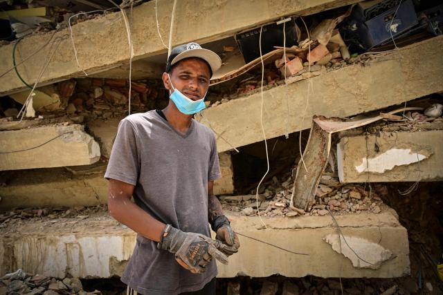 Raul Alvarado searches for missing relatives amid rubble in the Caribe sector of Caraballeda, La Guaira state, Venezuela, on July 6, 2026, following powerful earthquakes that struck the region. The earthquakes that struck Venezuela on June 24 have claimed the lives of at least 3,342 people, the Venezuelan government reported on July 5. (Photo by MARTIN BERNETTI / AFP)