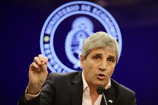 (FILES) Argentina's Minister of Economy, Luis Caputo, speaks during a press conference at the Ministry of Economy offices in Buenos Aires on June 28, 2024. Caputo announced on July 6, 2026, that Javier Milei’s government has enough funds to meet the debt payments for this year -of around 19 billion dollars- and he described turning to the international market to refinance maturities as “an option". (Photo by Emiliano Lasalvia / AFP)