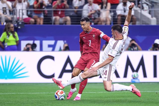 Portugal's forward #07 Cristiano Ronaldo kicks the ball and misses a chance pas Spain's defender #14 Aymeric Laporte during the 2026 World Cup round of 16 football match between Portugal and Spain at the Dallas Stadium in Arlington on July 6, 2026. (Photo by Thomas COEX / AFP)