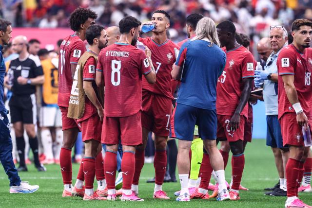 Portugal's forward #07 Cristiano Ronaldo and temmates take the hydration break during the 2026 World Cup round of 16 football match between Portugal and Spain at the Dallas Stadium in Arlington on July 6, 2026. (Photo by Thomas COEX / AFP)