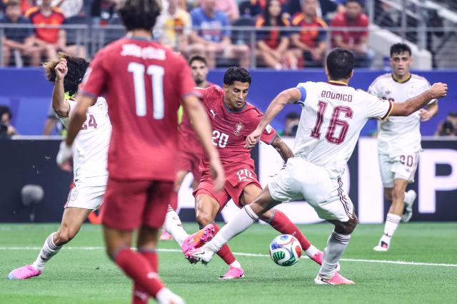 Portugal's defender #20 Joao Cancelo kicks the ball during the 2026 World Cup round of 16 football match between Portugal and Spain at the Dallas Stadium in Arlington on July 6, 2026. (Photo by Thomas COEX / AFP)