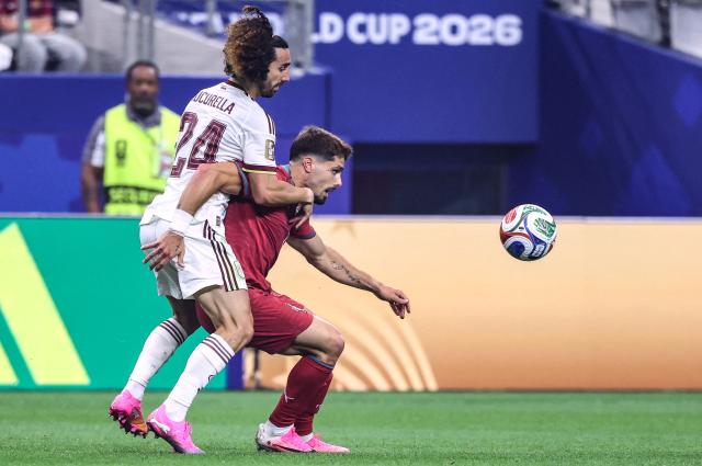 Portugal's forward #18 Pedro Neto (R) and Spain's defender #24 Marc Cucurella fight for the ball during the 2026 World Cup round of 16 football match between Portugal and Spain at the Dallas Stadium in Arlington on July 6, 2026. (Photo by Thomas COEX / AFP)