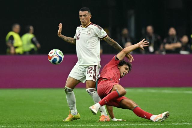Spain's defender #12 Pedro Porro and Portugal's forward #11 Joao Felix fight for the ball during the 2026 World Cup round of 16 football match between Portugal and Spain at the Dallas Stadium in Arlington on July 6, 2026. (Photo by Paul ELLIS / AFP)