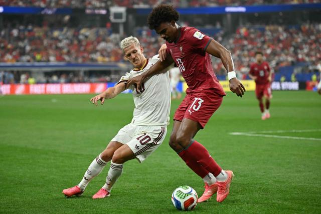 Spain's forward #10 Dani Olmo and Portugal's midfielder #13 Renato Veiga fight for the ball during the 2026 World Cup round of 16 football match between Portugal and Spain at the Dallas Stadium in Arlington on July 6, 2026. (Photo by Paul ELLIS / AFP)