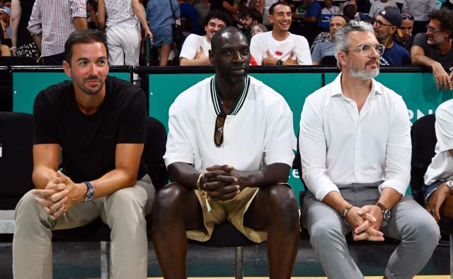 French actor Omar Sy (C) attends the qualifier basketball match between France and Finland for the men's 2027 FIBA World Championships at the Palais des Sports in Pau south-western France, on July 6, 2026. (Photo by Gaizka IROZ / AFP)